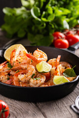 Delicious sea food, grilled shrimps with lemon