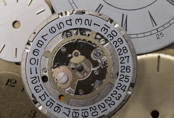 macro watches disassembled clockwork gears loose dials