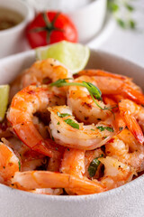 Grilled shrimps in a white ceramic bowl