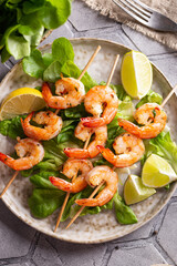 Freshly cooked grille shrimps with letucce on a plate