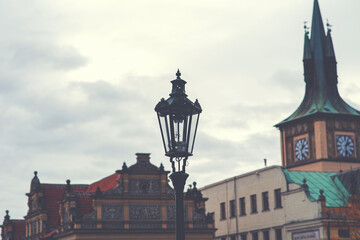Fototapeta na wymiar Vintage street lamps in Prague on the background of historical buildings. Toned image.