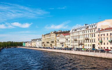 Fototapeta na wymiar River channel with boats in Saint-Petersburg. Saint Petersburg panorama with canals, historic buildings and beautiful architecture. Russia. Spring time. Travel inspiration.