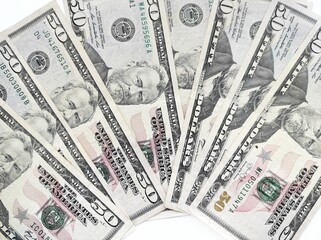 business, finance, savings, banking and people concept - close up bundle of money US fifty dollars banknotes