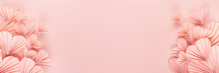 Fototapeta na wymiar Valentines day banner - pink paper ribbed hearts fly on soft light pastel pink background as sideways border with copy space, top view. Festive love backdrop for card, design, website, advertising.