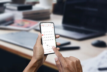 Businessman checks the calendar. Make plans for future work.
