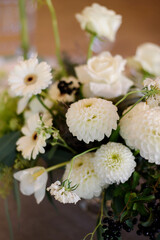 flowers with green leaves on wedding table