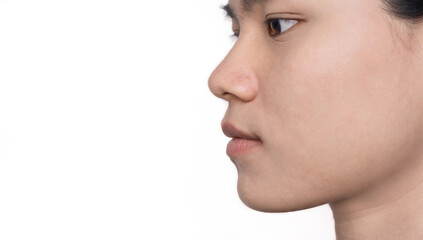 Fototapeta premium Portrait of young Asian woman with beautiful face and healthy facial skin perfect clean skin on white background. Girl facial treatment, Cosmetology, beauty, and spa. Beauty and Skincare Concept.