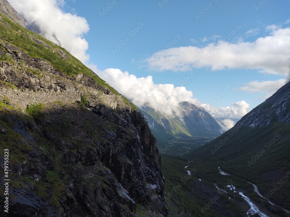 Poster clouds over the mountains