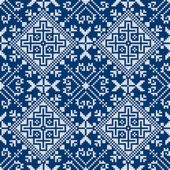 Cross-stitch embroidery style vector seamless pattern - inspired by the old folk art designs from Bosnia and Herzegovina Zmijanjski vez in white on blue
