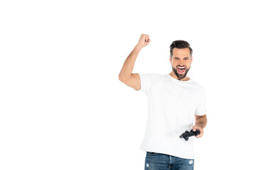 KYIV, UKRAINE - DECEMBER 5, 2021: excited man shouting and showing win gesture while playing video game isolated on white.