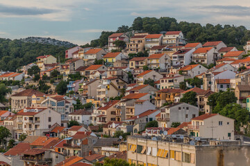 Fototapeta na wymiar Houses on slopes in Sibenik, Croatia
