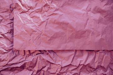 Fototapeta premium blank pink crumpled paper background. grunge crumpled backdrop. girl power abstract concept. Jewelry, cosmetics mockup.
