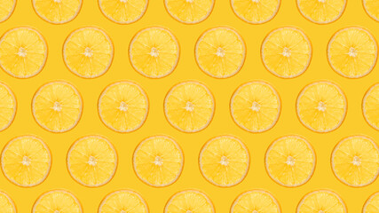 Orange slices pattern on yellow background