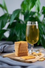 A glass of beer and crackers