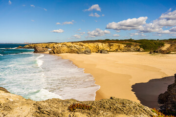 Huge sandy beach called Praia Grande de Porto Covo, Vicentina Route, Portugal.