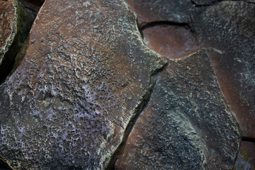 the texture of the stone is brown with large cracks