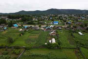 Aerial aerial view of a small village in a wooded area