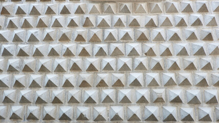 Vintage grey wall of pyramidal shape in Toledo, Spain. Concrete textured surface for backdrops