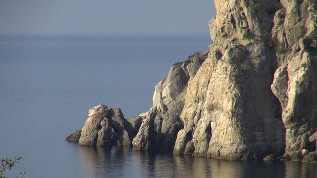 View of cliffs that close royal beach from waves and prying eyes at dawn. Close-up. scaly Calm and serene life in Crimea after return of peninsula to native harbor. Crimea New Swe 2014.

