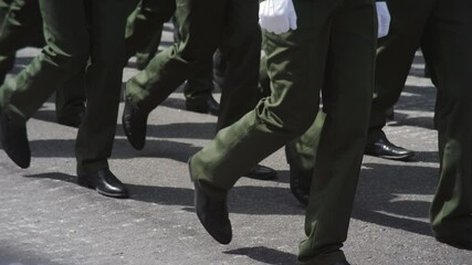 A close-up of the feet of military men who march on the parade . Same clothes and shoes in public. Military march close-up in slowmotion shooting.