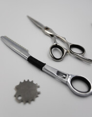 professional scissors and razor turn into a light background