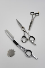 professional scissors and razor turn into a light background