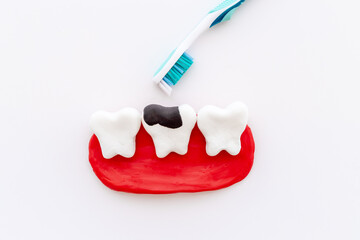 Teeth models with toothbrush. Oral health and care concept