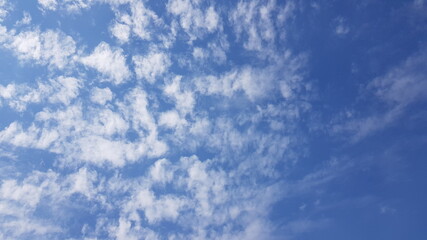 The sky is scattered with clouds.