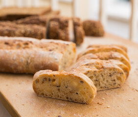 fresh loaf of bread on wooden board