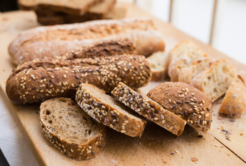 fresh loaf of bread on wooden board
