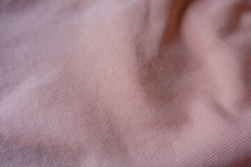 Pastel pink cotton jersey fabric in soft folds