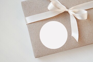 Round sticker mockup for sticker, label, logo design presentation,  gift package with white ribbon..