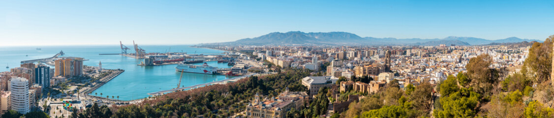 Panoramic of the city, the town hall and its gardens and the port from the Gibralfaro Castle in the city of Malaga, Andalusia. Spain