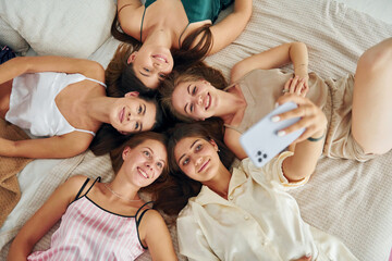 Top view of group of happy women that is at a bachelorette party