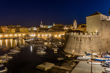 Fototapeta na wymiar Evening view of boats in the old town of Dubrovnik, Croatia