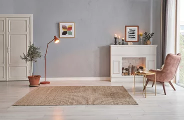 Foto op Plexiglas Modern room concept interior style, chair fireplace frame wicker carpet decoration, grey stone wall background. © UnitedPhotoStudio