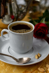 Good morning, delicious pastries, breakfast retro elegant cup of coffee book flowers on wooden table.