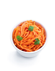 Delicious spicy carrot salad in ceramic bowl isolated on white