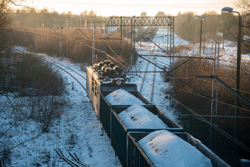 electric locomotive pulling coal cars to the power plant during a very cold winter