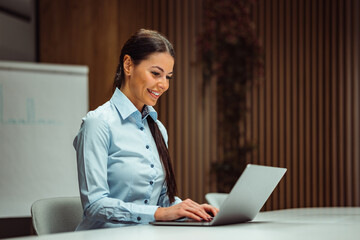 Happy caucasian businesswoman, attending a meeting online, on her laptop.