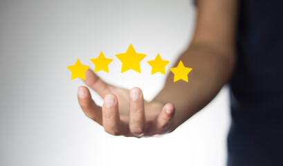 Male Customer Assessment Feedback gives a positive review for Customer Satisfaction Survey. five star rating service rating Satisfaction Concept.