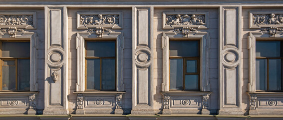 Vintage building facade wall. Rounded windows. Classic architecture historic buildings of St. Petersburg.