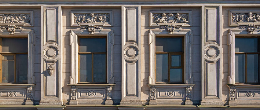 Fototapeta Vintage building facade wall. Rounded windows. Classic architecture historic buildings of St. Petersburg.