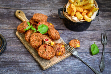 Home made oven baked  mini chicken  meatballs , chily peppers and fresh   cherry tomatoes on  rustic background. Diet  ketogenic food.
