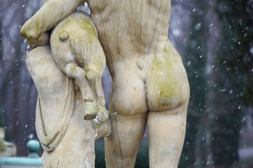 antique statues in winter park, back view - Powered by Adobe