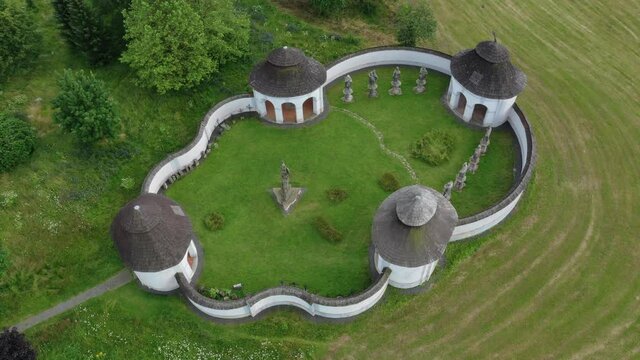Old chapels, buildings and statues of saints at former small cemetery in Zdar nad Sazavou, Czech Republic
