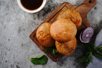 Kachori or Kachouri - Popular deep fried Indian snack served with chutney, selective focus - obrazy, fototapety, plakaty