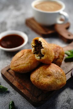 Kachori or Kachouri - Popular deep fried Indian snack served with chutney, selective focus