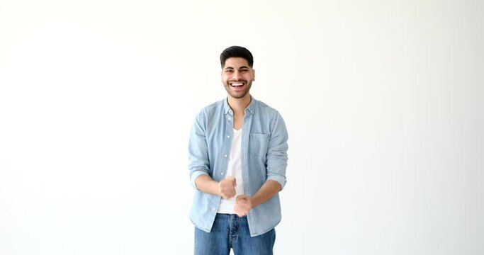 Surprise and excited young man over white background