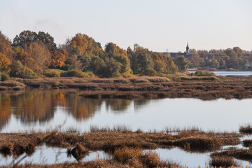 Beatufiul nature landscape view of lovely river with yello, orange colors.